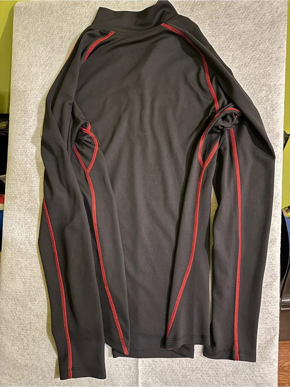 The North Face Men’s Black Half-Zip Performance Jacket with Red Accents